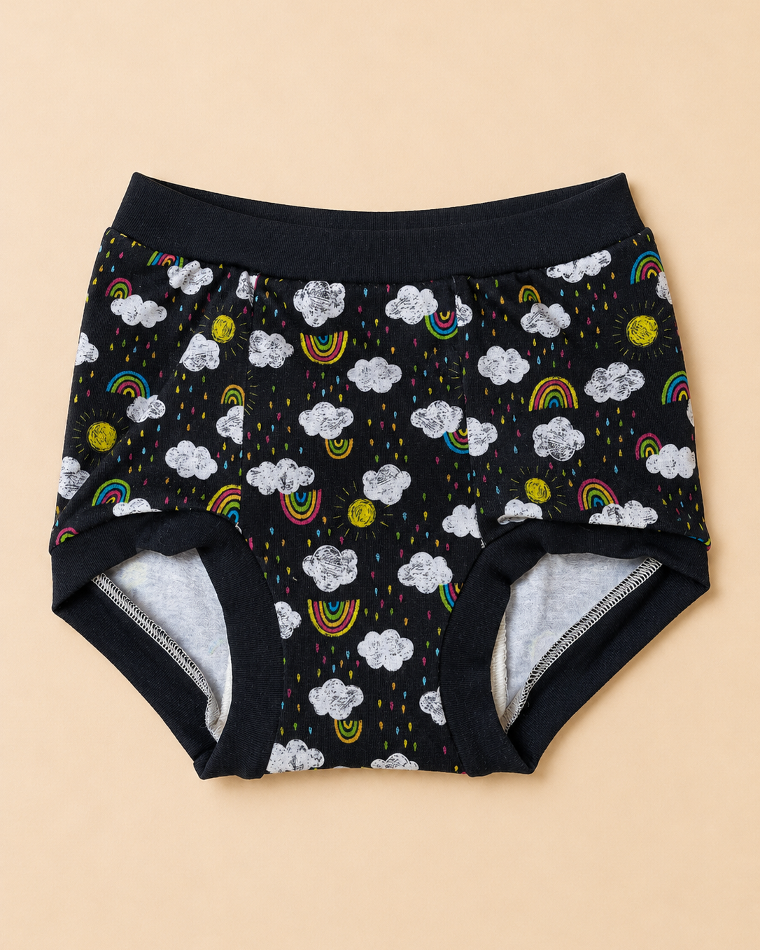 Black baby underwear with a colorful cloud, rainbow, and sun print, featuring a gray fleece lining visible at the leg openings, laid flat on a beige background.