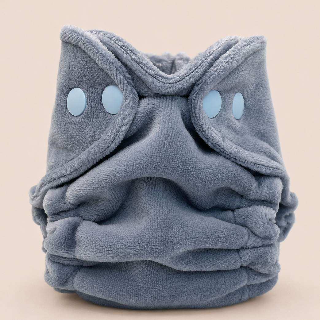 A plush, dusty blue cloth diaper