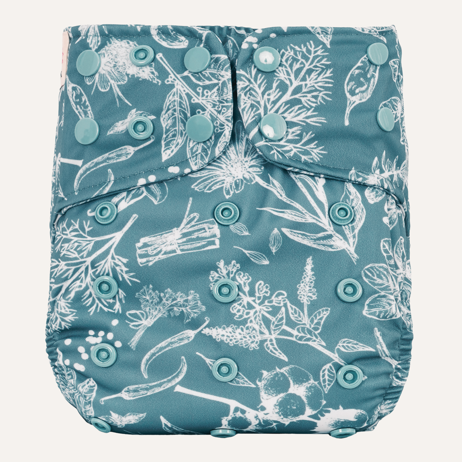 Blue diaper cover with white floral pattern on a white background
