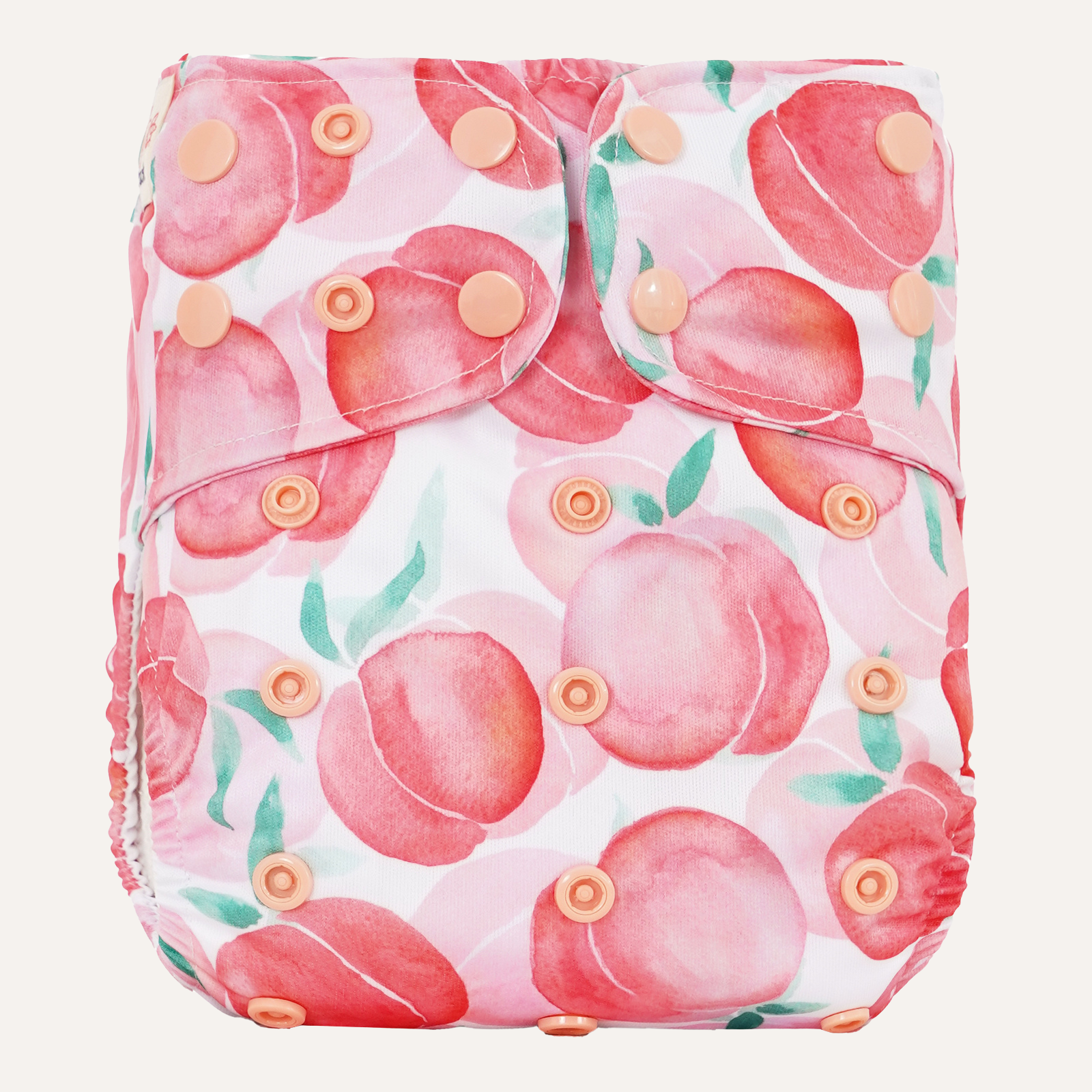 Reusable diaper cover with pink peach pattern on a white background