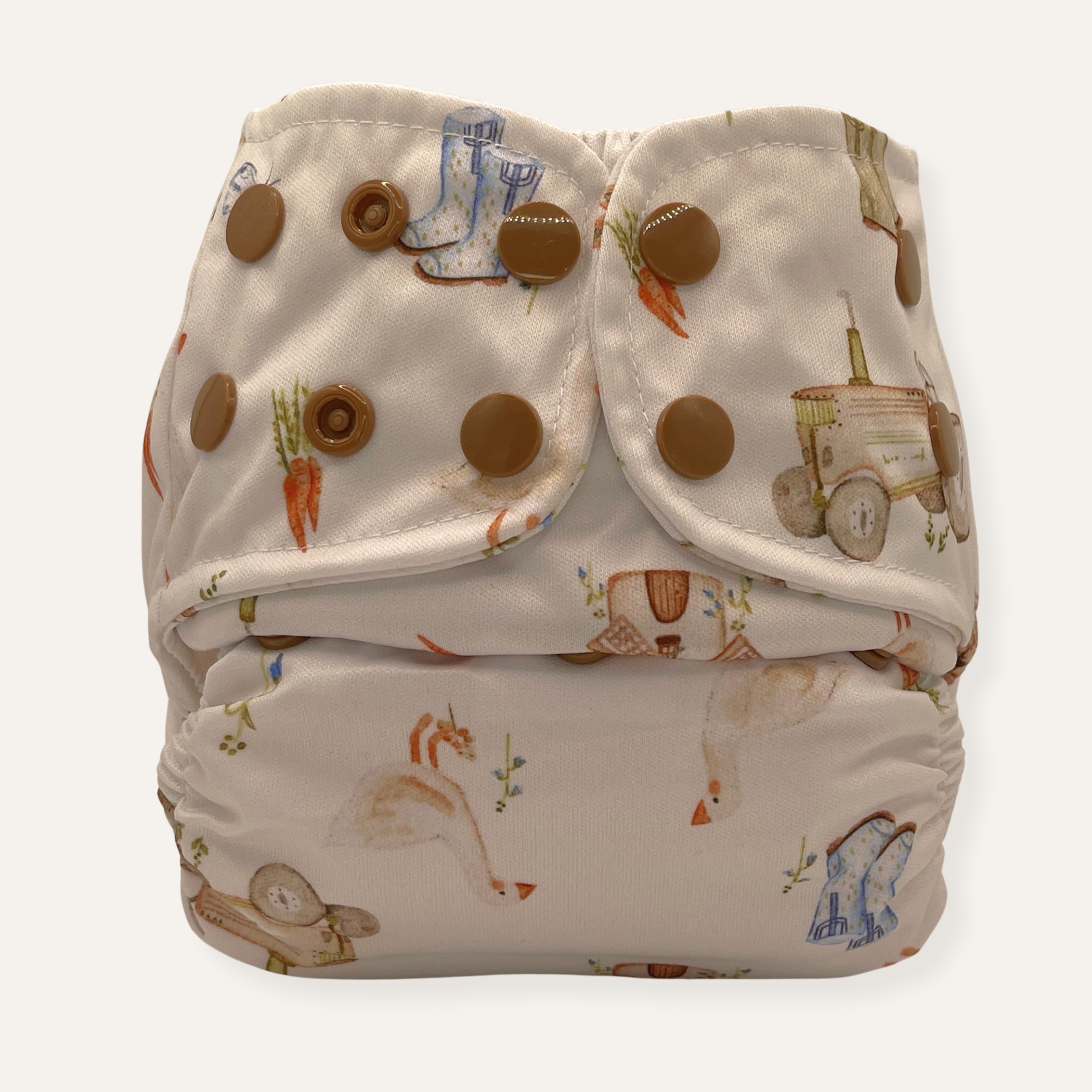 Patterned cloth diaper with brown buttons on a white background