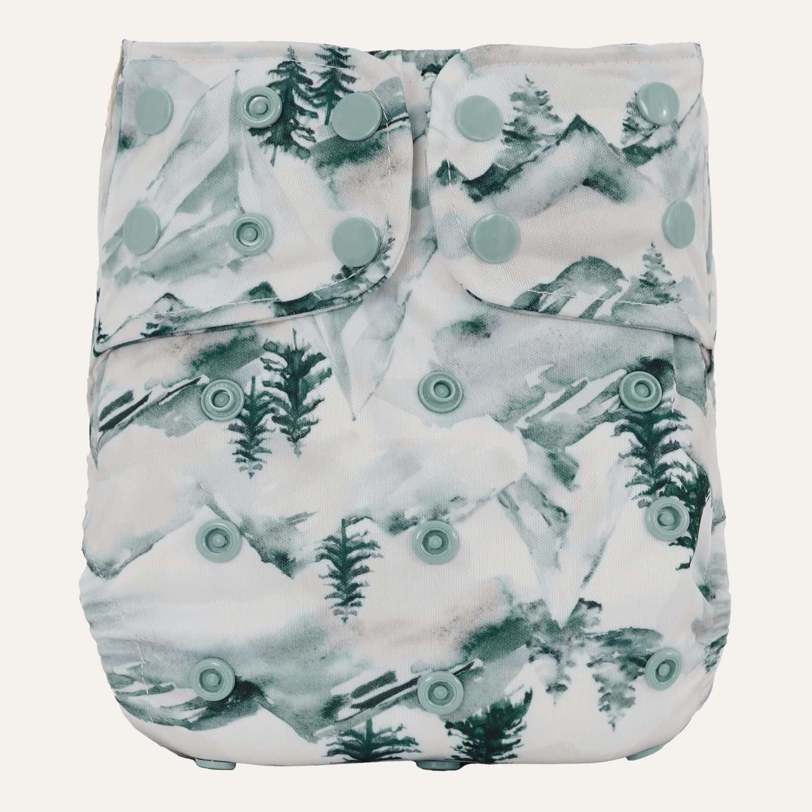 Patterned diaper with green trees and circles on a white background