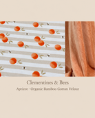 A fabric swatch presentation for 'Clementines & Bees' apricot organic bamboo cotton velour. The left panel shows a close-up of the patterned fabric with horizontal beige and white stripes, decorated with watercolor-style orange apricots, green leaves, and small black bees.