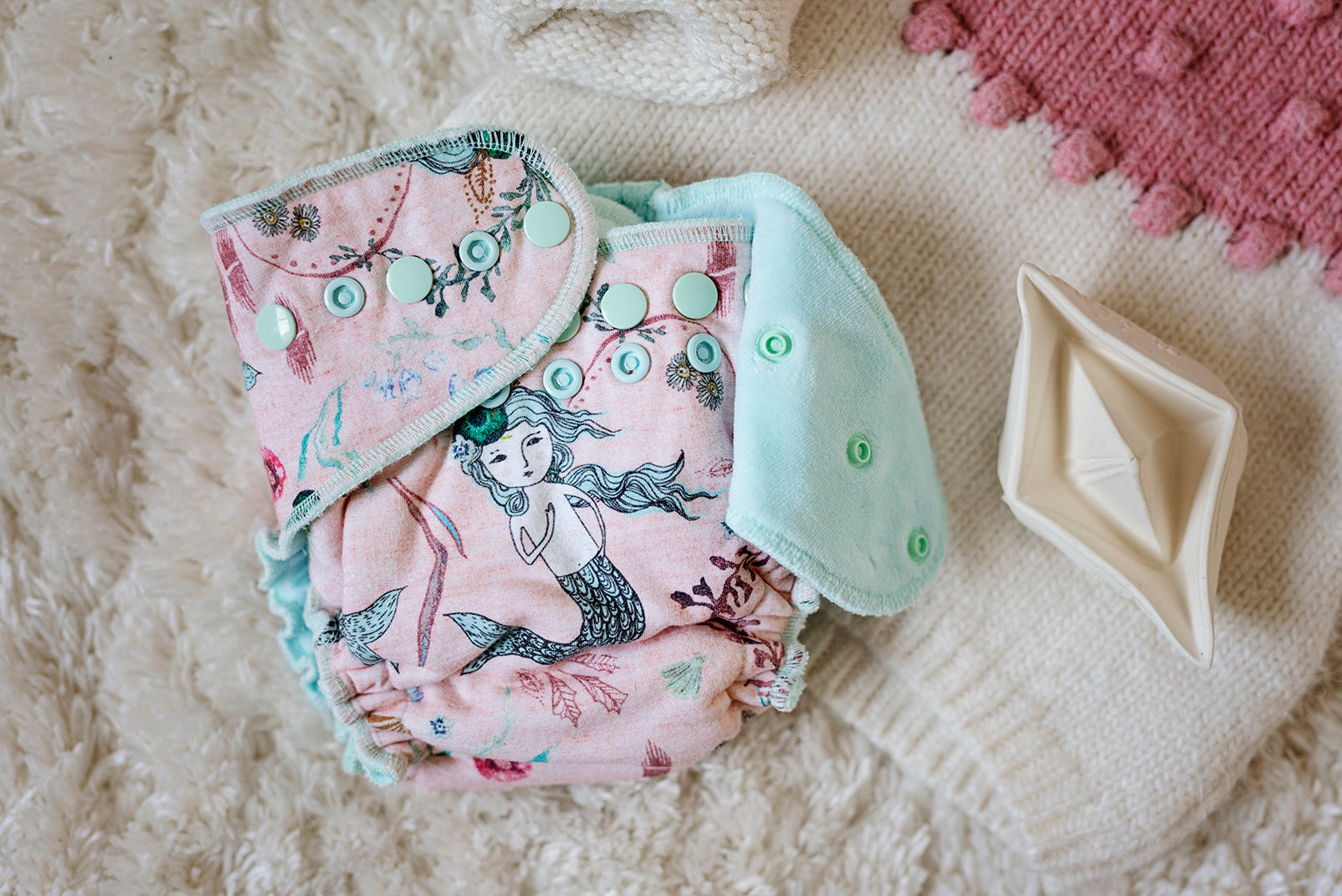Cloth diapering 101 guide showing different reusable diaper styles