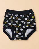 Black baby underwear with a colorful cloud, rainbow, and sun print, featuring a gray fleece lining visible at the leg openings, laid flat on a beige background.