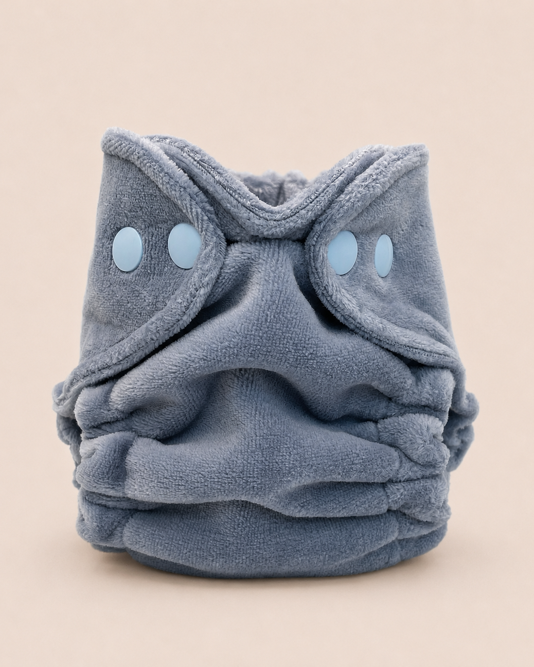 A plush, dusty blue  cloth diaper