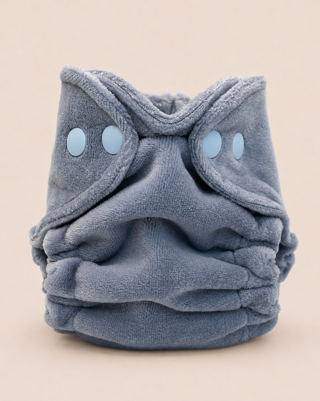 A plush, dusty blue  cloth diaper
