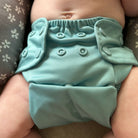 infant baby wearing all in two cloth diaper