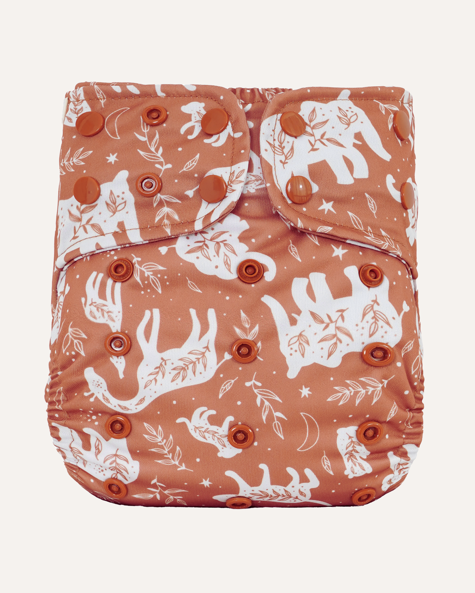 Patterned diaper cover with white animal designs on a light background