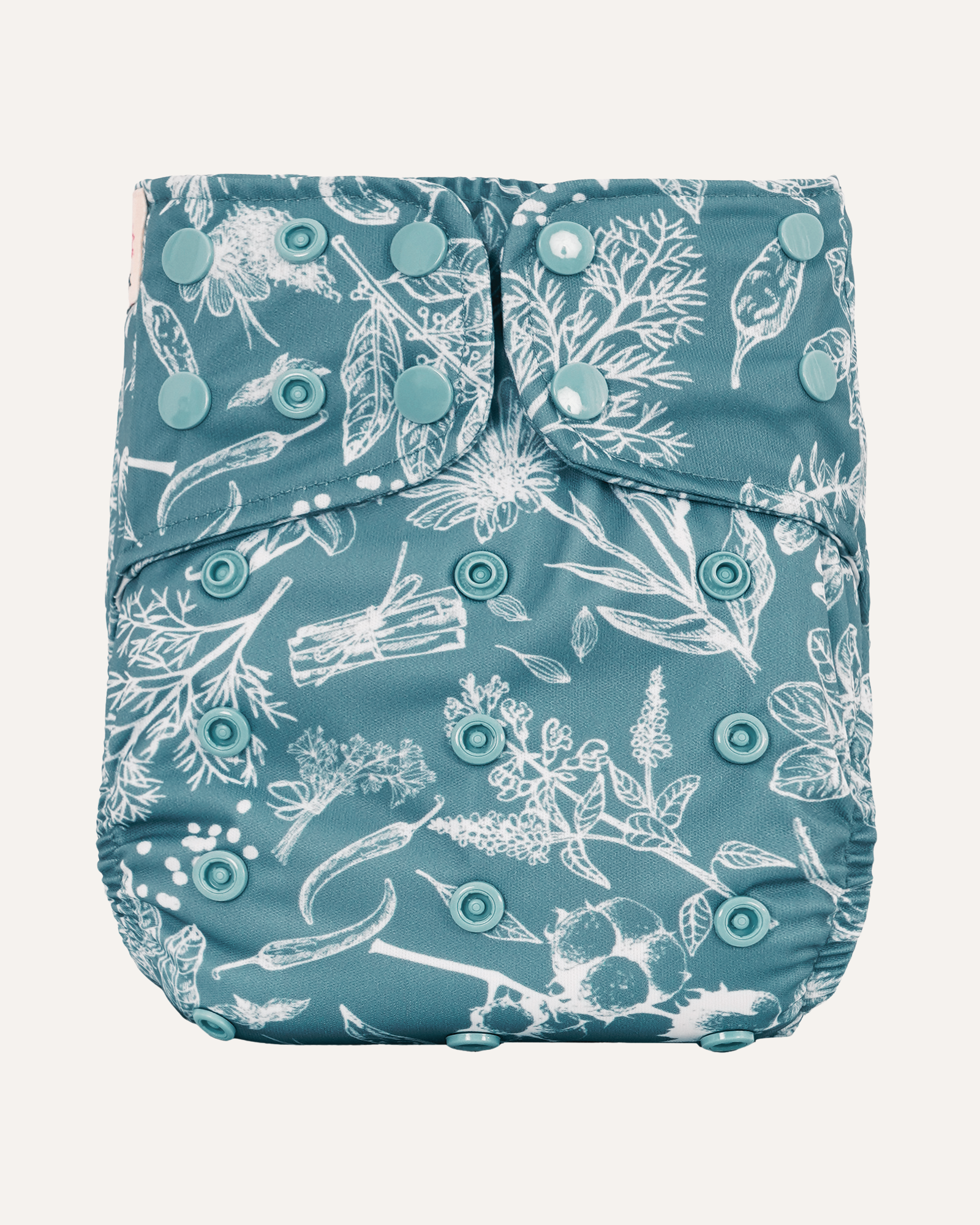 Blue diaper cover with white floral pattern on a white background