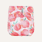 Reusable diaper cover with pink peach pattern on a white background