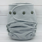 Gray cloth diaper on a light wooden background