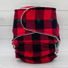 Red and black plaid diaper on a white background