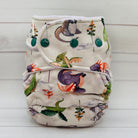 Patterned cloth diaper on a white wooden background