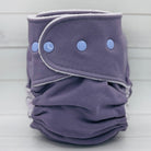 Purple cloth diaper with button closures on a light gray background