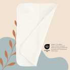 White diaper insert with Oeko-Tex logo on a beige and blue background